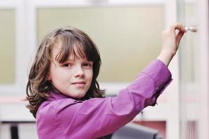 happy school girl on math classes photo