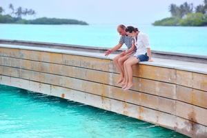 happy young couple have fun on beach photo