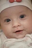 portrait of happy newborn little baby smilling photo