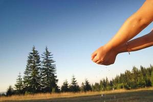 fresh water falling on children hands photo