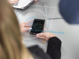 Elegant Woman Using Mobile Phone in office building photo