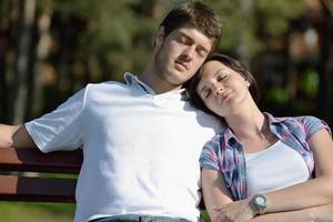 Portrait of romantic young couple smiling together outdoor photo