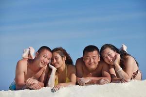 group of happy young people have fun on bach photo