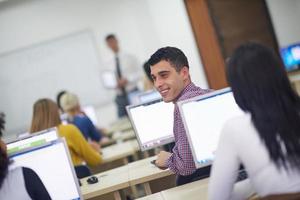 students group in computer lab classroom photo