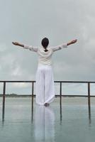 young woman relax on cloudy summer day photo