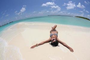 beautiful young woman  on beach have fun and relax photo