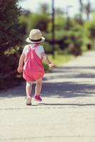 little girl runing in the summer Park photo