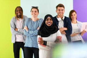 group of diverse teenagers posing in a studio, determined teenagers in diverse clothing. photo