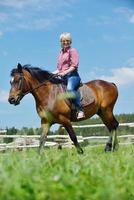 happy woman  on  horse photo