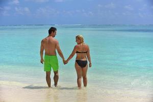 happy young  couple at summer vacation have fun and relax at beach photo