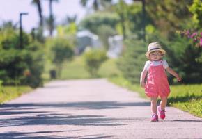 little girl runing in the summer Park photo