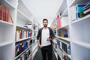 student with tablet in library photo