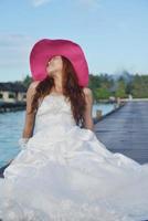 asian bride on beach photo