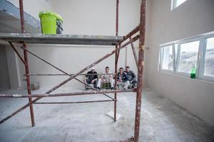 portrait of Workers and builders with dirty uniform in apartment photo