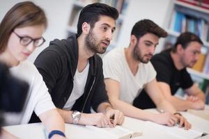 group of students study together in classroom photo