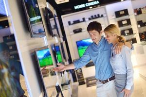 People in electronics store photo