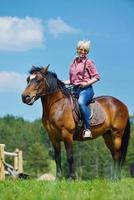 happy woman  ride  horse photo