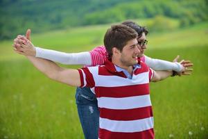 Portrait of romantic young couple smiling together outdoor photo