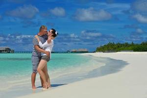 happy young  couple at summer vacation have fun and relax at beach photo