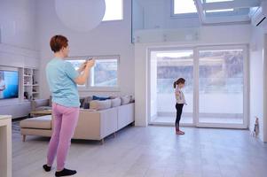 family at home little girl have online ballet training photo