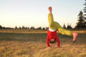 Girl doing exercise in nature photo