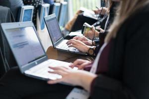 close up of business people hands using laptop computer photo