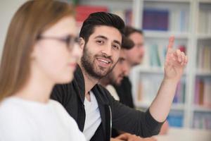 group of students  raise hands up photo