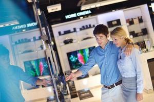 People in electronics store photo