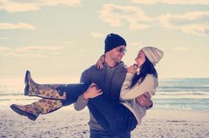 Couple chating and having fun at beach bar photo