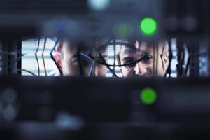 it engineers in network server room photo