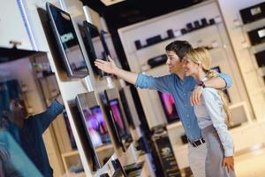 People in electronics store photo