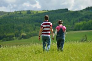 Portrait of romantic young couple smiling together outdoor photo