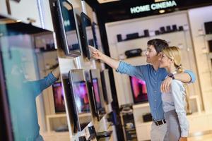 People in electronics store photo