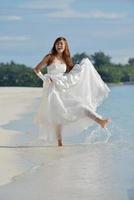 asian bride on beach photo