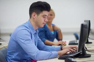 students group in computer lab classroom photo