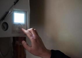 engineer checking technical data of heating system photo