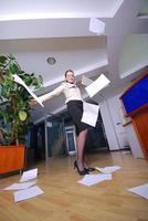 .happy businesswoman throwing documents photo