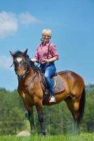 happy woman  on  horse photo