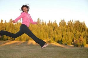 pretty girl jumping in a air photo