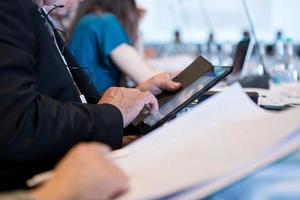 close up of business people hands using tablet computer photo