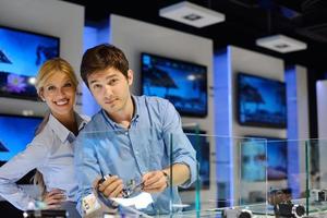 People in electronics store photo