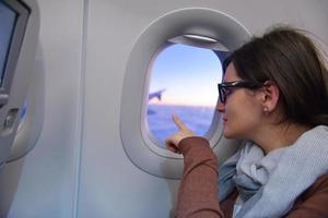 woman in airplane travel photo