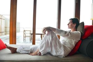 happy young woman relax at home on sofa photo