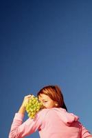 girl with grape outdoor photo