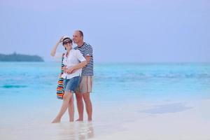 happy young couple have fun on beach photo