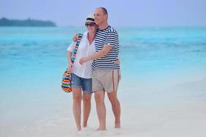 happy young couple have fun on beach photo