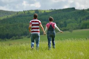 Portrait of romantic young couple smiling together outdoor photo