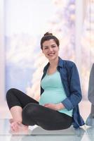 pregnant women sitting on the floor photo