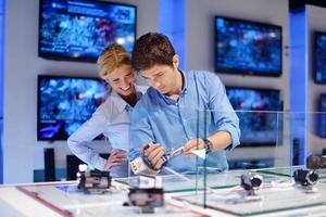 People in electronics store photo