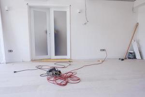 carpenters installing glass door with a wooden frame photo
